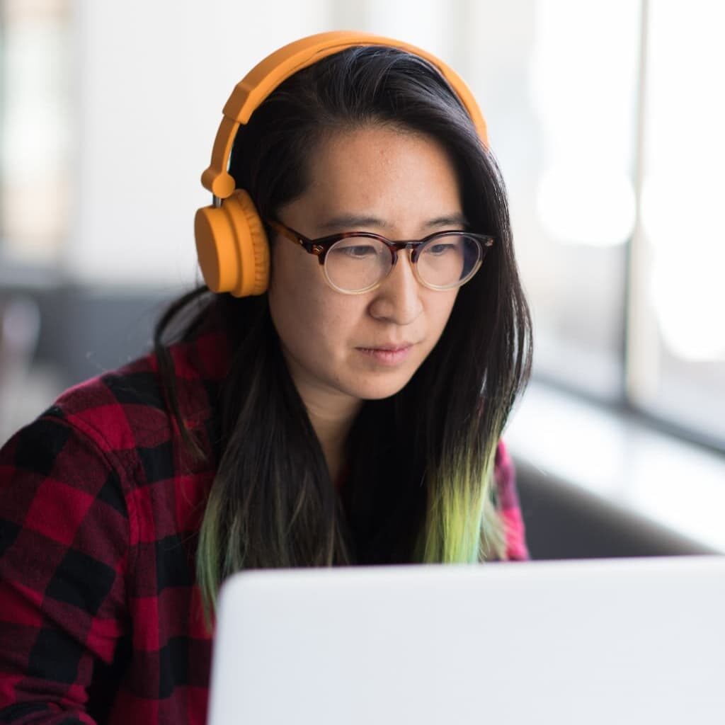 Woman with Laptop. Photo by Christina Wocintechchat, Unsplash